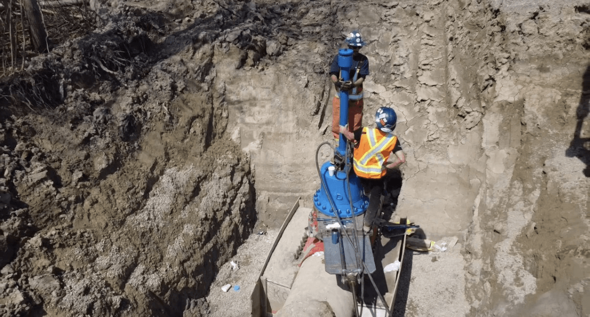 Pipeline Repair Services crew servicing a live valve in an open trench